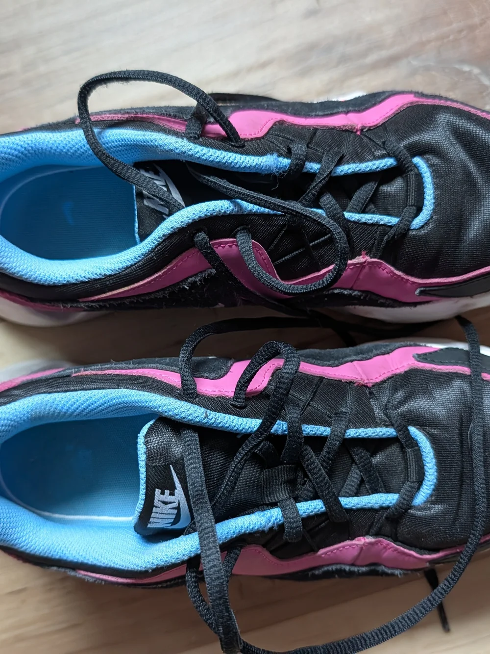 Nike Women's Black Sneakers with Pink and Light Blue Accents